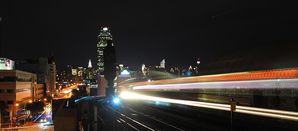 Energy Technician: shot of LaGuardia at night with the 7 train passing by