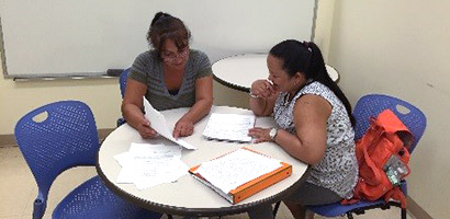 Staff Tutoring Students at the Writing Center